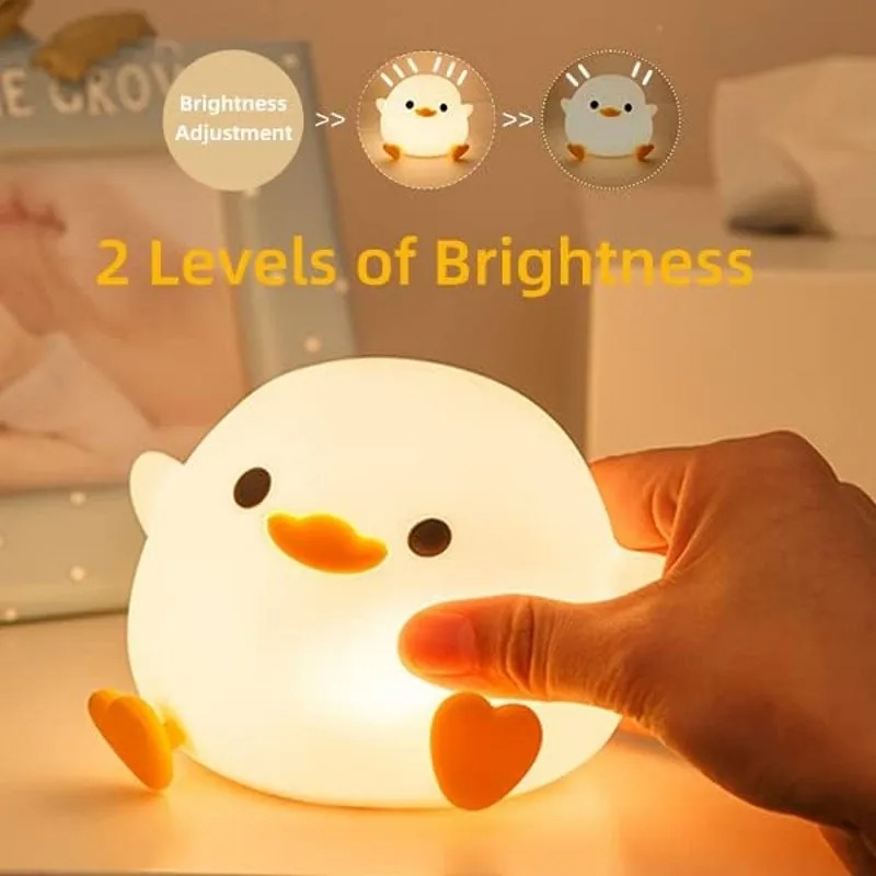 Front view of Doudou Duck night light on a bedside table