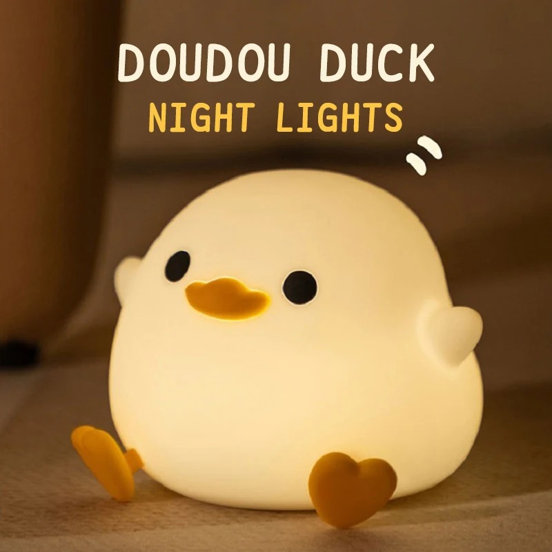 Doudou Duck night light with warm glow illuminating a room