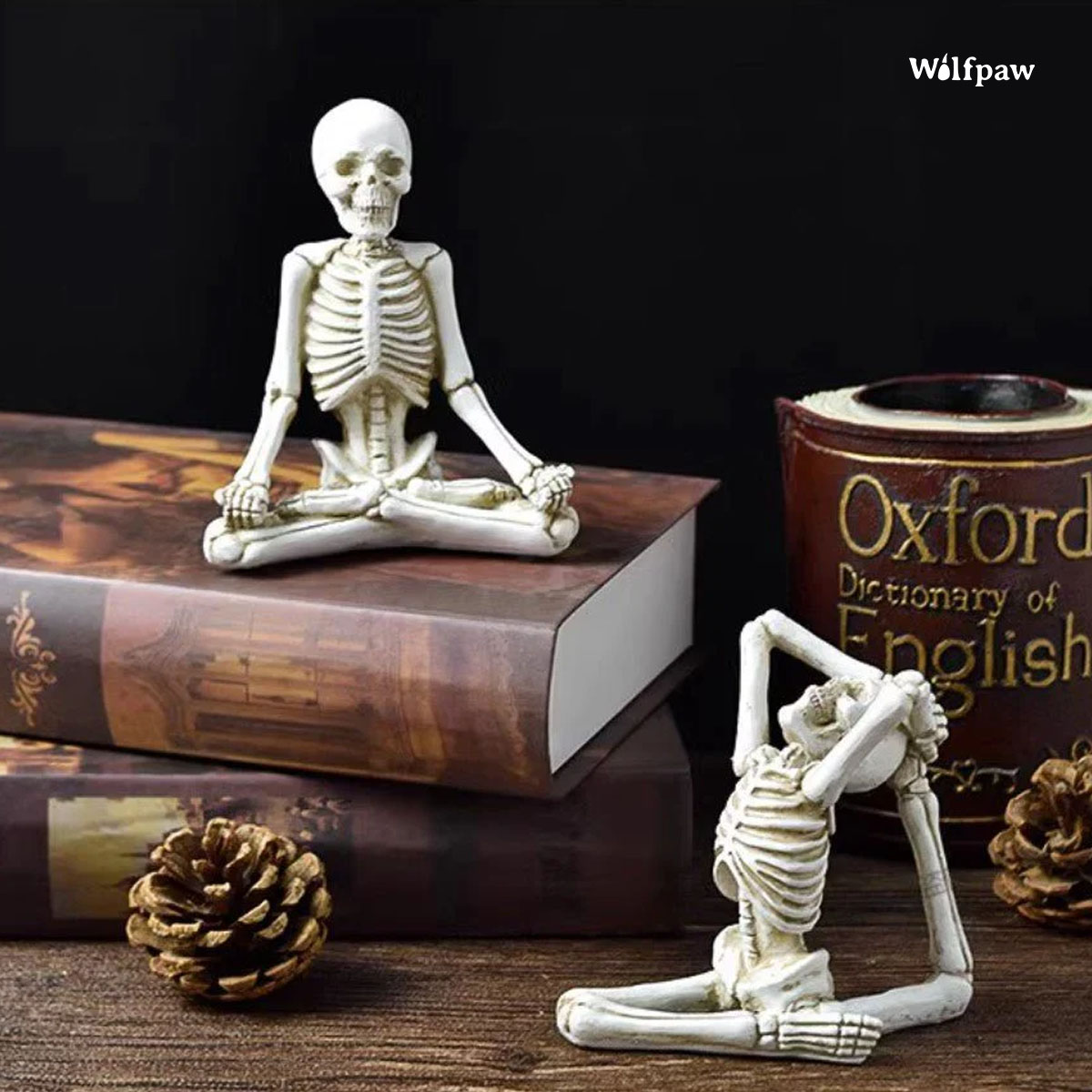 A skeleton seated on an open book, with another book placed beside it, creating a whimsical literary scene.